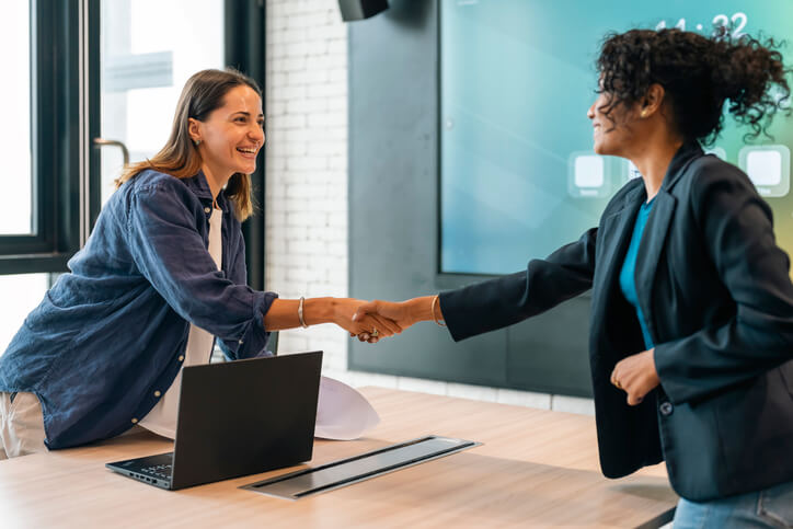 Woman editing her social media profile on her cell phone at home.
