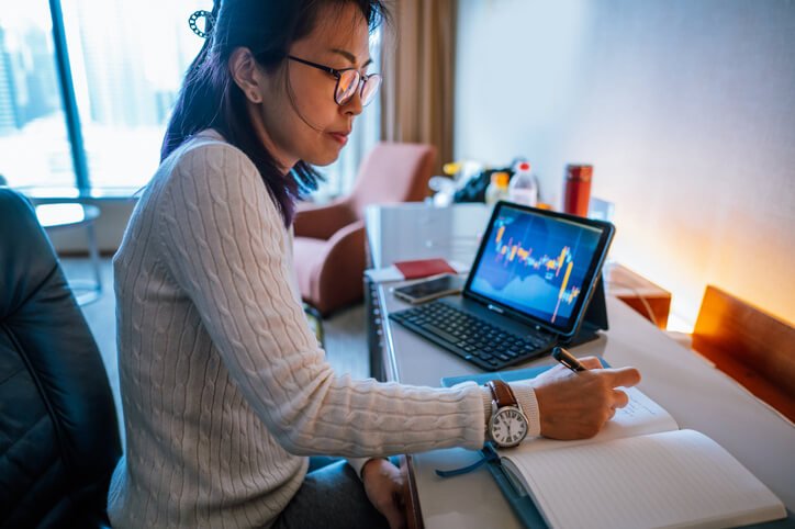 Woman editing her social media profile on her cell phone at home.