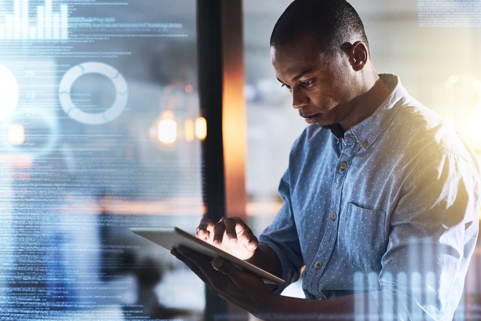 Male analyst using AI tool on a tablet device.